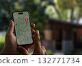 man searching for hotel GPS Map to Route Destination network connection Location Street Map with GPS Icons Navigation 132771734