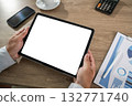 businessman holds a mockup tablet Blank Screen Mockup for UX/Presentation Mockup replaces your design 132771740