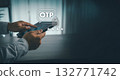 Mobile device verifying identity with OTP code. Concept of cybersecurity and two-factor authentication with generous copy space for ads and websites. 132771742