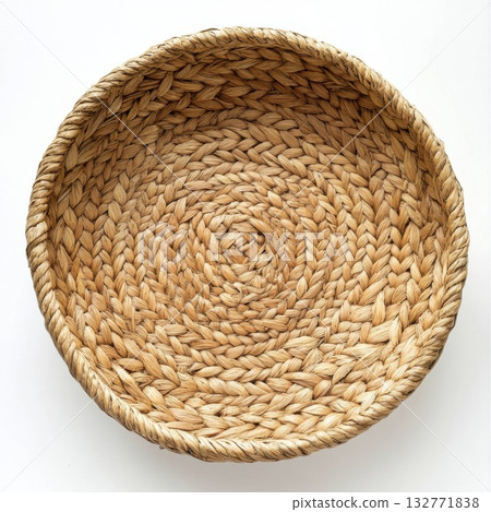 Handwoven natural fibers basket showcasing intricate weaving patterns and a warm earthy tone for home decor or storage 132771838