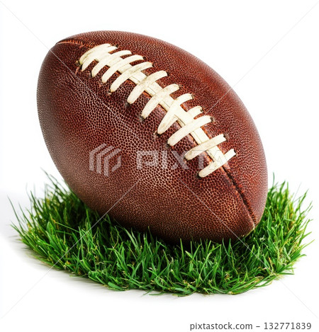 Classic brown football resting on lush green grass, perfect for a game on a sunny day 132771839