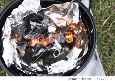 Burning charcoal on a barbecue grill Burning charcoal on a barbecue grill 132772809