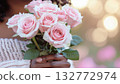 High-resolution image of a bouquet of pink roses held by a woman 132772974