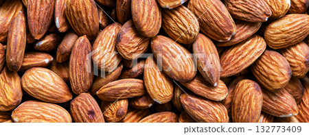 Almond. Close up of almond nuts background. Top view Almond. Close up of almond nuts background. Top view 132773409