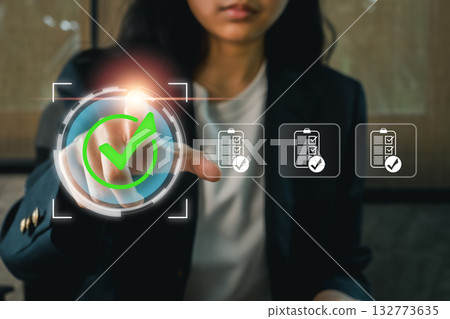 Businesswoman conducting an internal audit, focusing on data analysis and compliance in a corporate environment. Businesswoman conducting an internal audit, focusing on data analysis and compliance in a corporate environment. 132773635