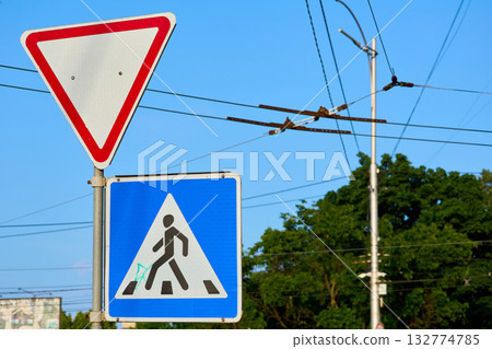 Crossroads.Road signs Pedestrian crossing and Give way on a street Crossroads.Road signs Pedestrian crossing and Give way on a street 132774785