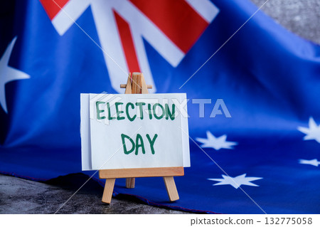 Australian flag with message text ELECTION DAY for political coverage. Patriotic signage and flag for voter outreach or campaign branding. Concept of democracy and civic duty suitable for voter 132775058