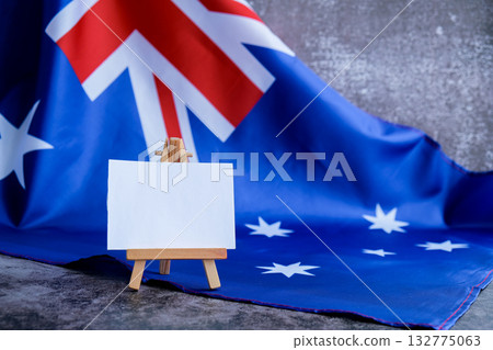 Mock-up for custom copy designs. Clean empty message board next to Australian flag. Place your logo or text on the white paper board next to the Australian flag. Modern mock-up template with national Mock-up for custom copy designs. Clean empty message board next to Australian flag. Place your logo or text on the white paper board next to the Australian flag. Modern mock-up template with national 132775063