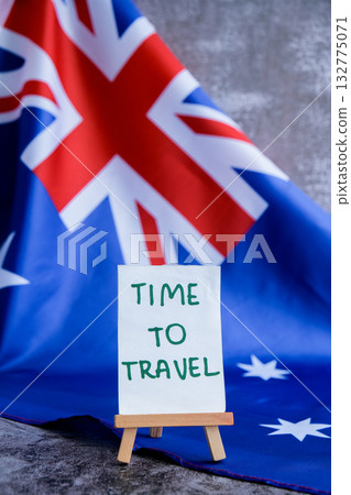 Australian flag and text TIME TO TRAVEL perfect for tourism or vacation advertising. Concept of wanderlust and national adventure use in travel guides Australian flag and text TIME TO TRAVEL perfect for tourism or vacation advertising. Concept of wanderlust and national adventure use in travel guides 132775071