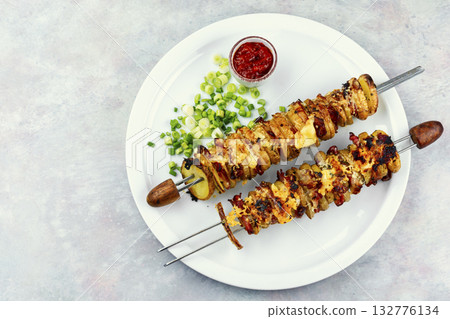 Grilled vegetable bacon kebabs. 132776134