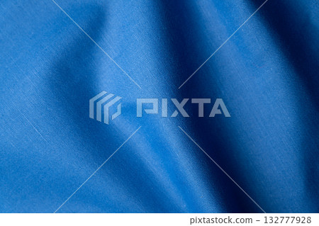 Wrinkled and textured blue fabric texture background 132777928