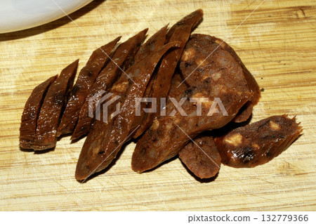Close up of chorizo slices on a cuting board Close up of chorizo slices on a cuting board 132779366