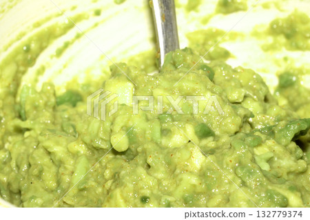 Close up of smashed avocado in a bowl Close up of smashed avocado in a bowl 132779374