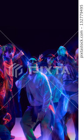 Hip hop dance team performing with neon motion blur 132779495