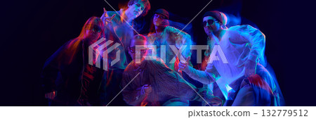 Street dancers posing under vivid motion blur lights. Banner Street dancers posing under vivid motion blur lights. Banner 132779512