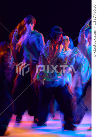 Young dancers in colorful hip hop performance with motion blur Young dancers in colorful hip hop performance with motion blur 132779516