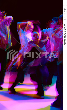 Group of hip hop dancers performing with colorful motion blur Group of hip hop dancers performing with colorful motion blur 132779536