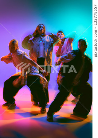 Dance crew performing synchronized moves with motion blur Dance crew performing synchronized moves with motion blur 132779557