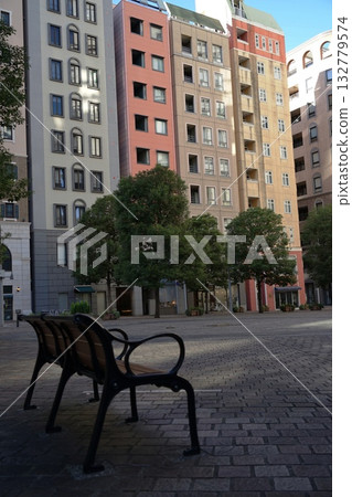 An empty park bench in November, Minato Ward, 2031, Italian Town, daytime An empty park bench in November, Minato Ward, 2031, Italian Town, daytime 132779574