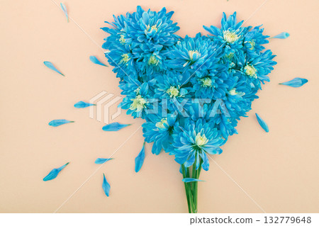 Tree of Love concept: blue chrysanthemum flowers arranged in a stylised tree shape 132779648