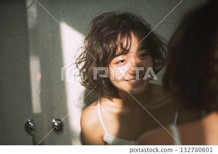 AI-generated image: Portrait of a smiling woman in a bathroom 132780601