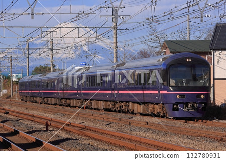 The 485 Series Joyful Train Hana speeds along the Tokaido Line freight line, watched over by the majestic Mount Fuji. Photo taken on January 1, 2011. The 485 Series Joyful Train Hana speeds along the Tokaido Line freight line, watched over by the majestic Mount Fuji. Photo taken on January 1, 2011. 132780931