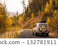 Japanese SUV on scenic autumn road in the forest 132781911