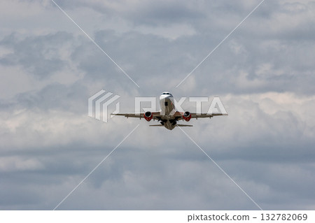 Takeoff of a passenger jet in hot summer weather Takeoff of a passenger jet in hot summer weather 132782069