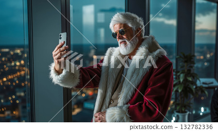 A man dressed as Santa Claus taking a selfie with his phone 132782336