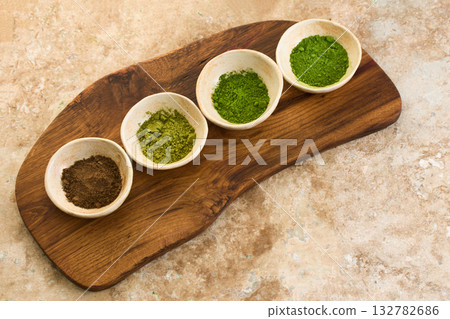 Matcha Ceremony Setup. Ceramic bowls with matcha powder and tools for a traditional tea ceremony Matcha Ceremony Setup. Ceramic bowls with matcha powder and tools for a traditional tea ceremony 132782686