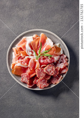 plate of prosciutto  on grey table background 132782785