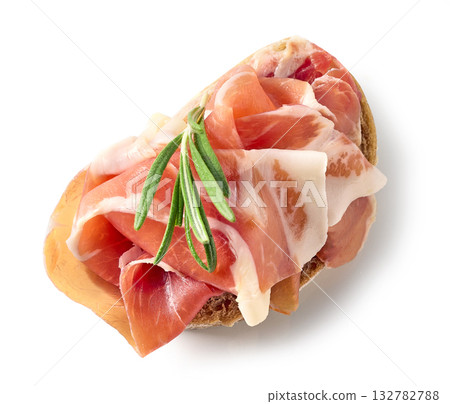 ciabatta bread slice with prosciutto meat isolated on white background ciabatta bread slice with prosciutto meat isolated on white background 132782788