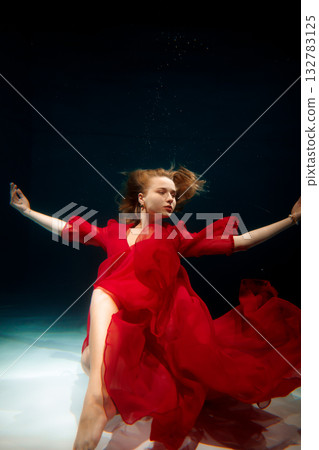 Serene water environment highlights athletic elegance and form Serene water environment highlights athletic elegance and form 132783125