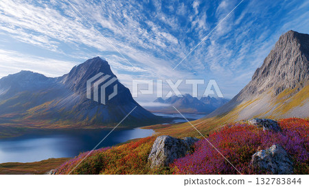 Vibrant Mountain Landscape with Colorful Alpine Flowers Overlooking Clear Lake and Expansive Mountain Ranges under a Dynamic Sky Vibrant Mountain Landscape with Colorful Alpine Flowers Overlooking Clear Lake and Expansive Mountain Ranges under a Dynamic Sky 132783844