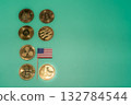 A collection of various cryptocurrencies and a small American flag on a mint green background, representing the digital economy. 132784544