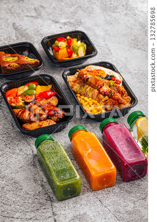 Healthy meal prep containers with meal and juices 132785698
