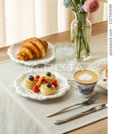 Mini cheesecakes with berries and nuts on plate 132785699