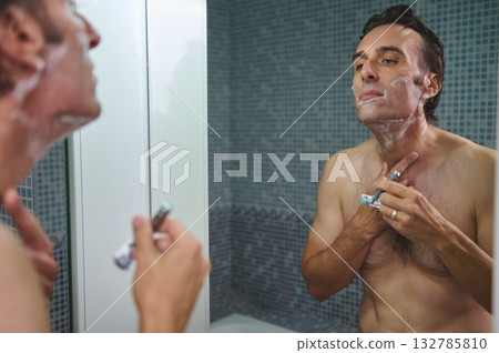 Man Shaving in Shower, Foamy Face, Reflective Mirror Moment, Grooming Routine Man Shaving in Shower, Foamy Face, Reflective Mirror Moment, Grooming Routine 132785810