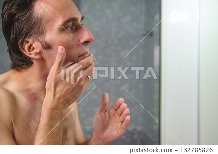 Contemplative Man In Shower Thinking, Hand On Chin, Reflective Moment Of Self Reflection And Quiet Thought 132785826