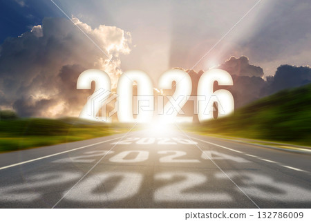 Go to the New Year 2026 concept. Road leading toward bright sunlight with bold 2026 numbers and shadows of previous years, symbolizing progress, growth, and the journey into the future. 132786009