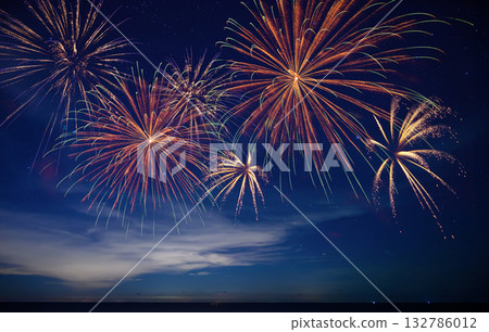 Stunning fireworks illuminate the night sky over the ocean, symbolizing celebration, hope, and the excitement of welcoming 2026 with bright new beginnings. 132786012