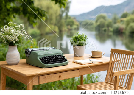 Vintage typewriter inspiring creativity outdoors by the river 132786703