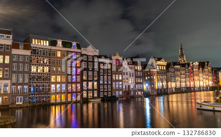 Amsterdam night city. Colorful houses canal water 132786830