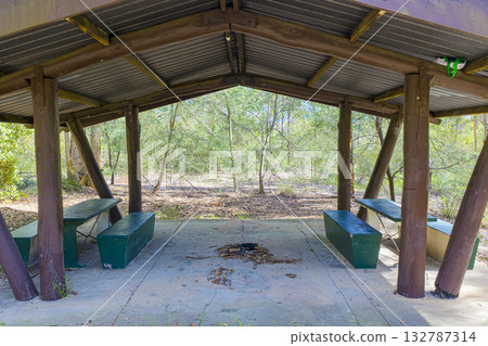 An old wooden picnic shelter in a forest in the Blue Mountains 132787314