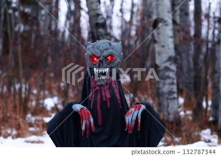 Halloween black bloody creepy demon in the night woodland. 132787344
