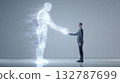 Man in suit shaking hands with transparent glowing AI figure 132787699
