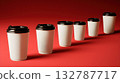 White coffee cups with black lids on red 132787717