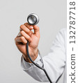 Doctor hand holding stethoscope on white background 132787718