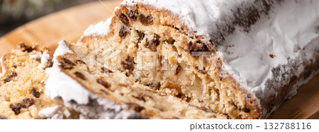 Traditional Christmas Stollen with Raisins and Powdered Sugar Traditional Christmas Stollen with Raisins and Powdered Sugar 132788116
