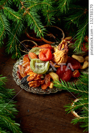 Assorted dried fruits and nuts on a silver tray. Assorted dried fruits and nuts on a silver tray. 132788170